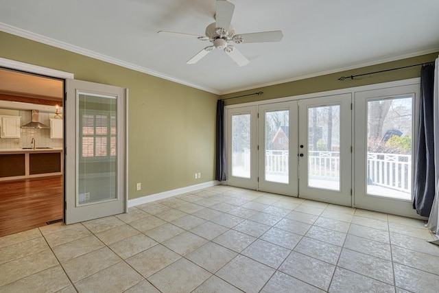 unfurnished room with a ceiling fan, crown molding, french doors, and a wealth of natural light
