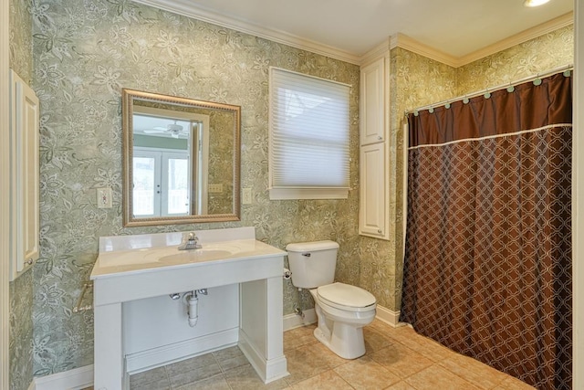 full bathroom featuring wallpapered walls, toilet, baseboards, and a sink