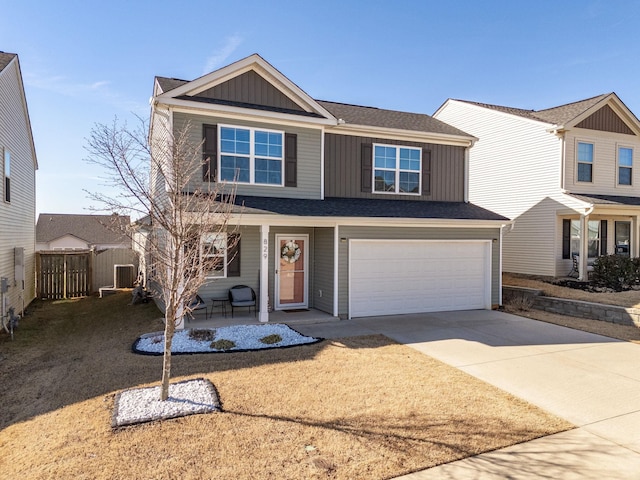 view of front of house with fence, covered porch, board and batten siding, concrete driveway, and an attached garage