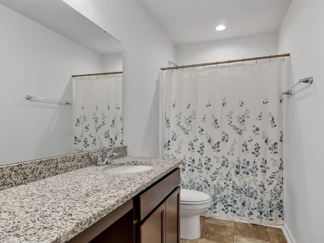 bathroom featuring vanity, toilet, and a shower with curtain