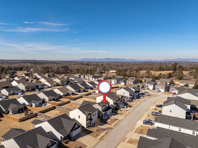 drone / aerial view with a residential view and a mountain view