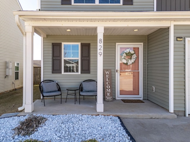 doorway to property featuring covered porch
