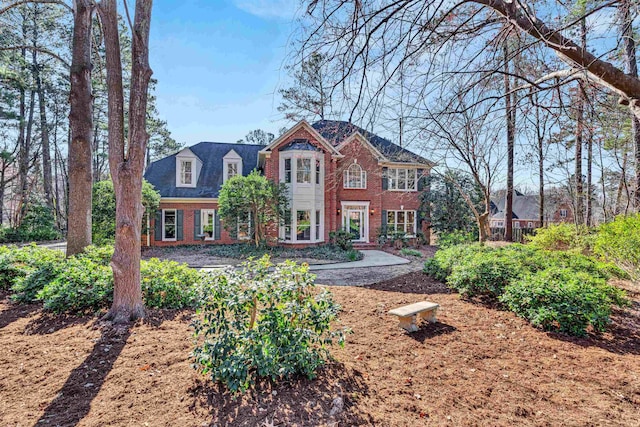 view of front of house featuring brick siding