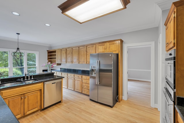 kitchen featuring ornamental molding, stainless steel appliances, a sink, open shelves, and light wood-type flooring