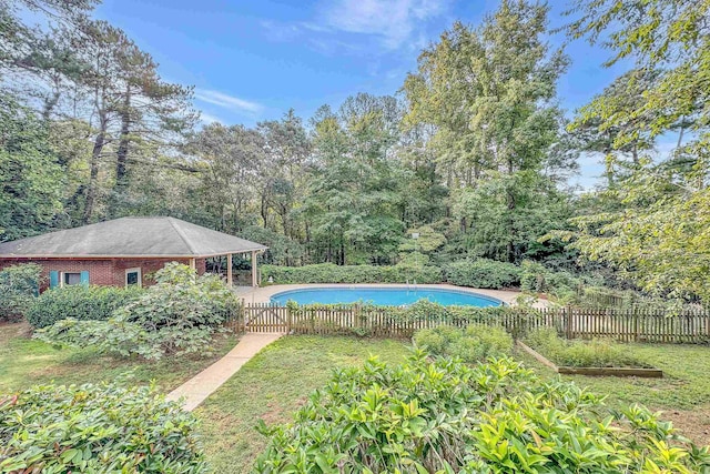 view of swimming pool with a fenced in pool and fence