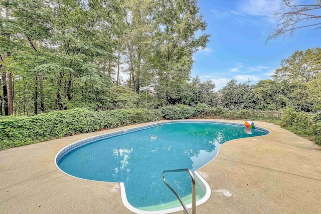 view of pool with a fenced in pool and a patio