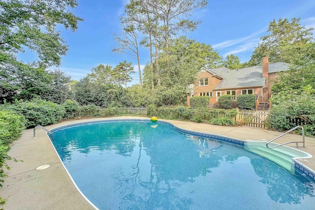 pool with a fenced backyard