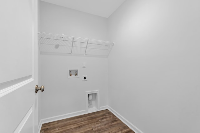 laundry room with washer hookup, electric dryer hookup, laundry area, baseboards, and dark wood-style flooring