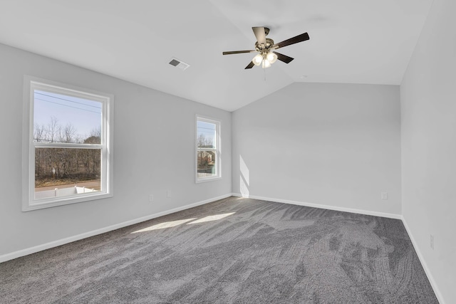 unfurnished room featuring carpet flooring, a ceiling fan, baseboards, and lofted ceiling