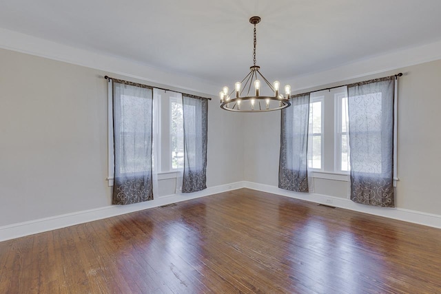 353 E Georgia, Woodruff, SC 29388 - empty room with baseboards, visible vents, a chandelier, and wood-type flooring
