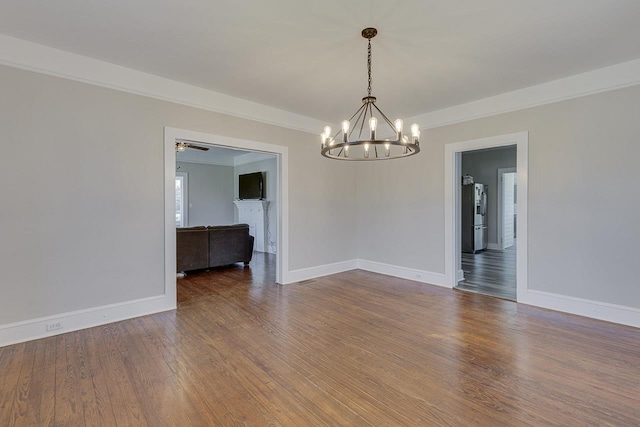 353 E Georgia, Woodruff, SC 29388 - spare room with ornamental molding, baseboards, a chandelier, and wood finished floors