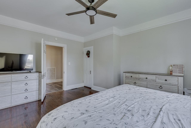 353 E Georgia, Woodruff, SC 29388 - bedroom with dark wood-style flooring, crown molding, baseboards, and visible vents