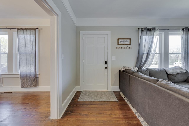 353 E Georgia, Woodruff, SC 29388 - entryway with dark wood-type flooring, baseboards, visible vents, and crown molding