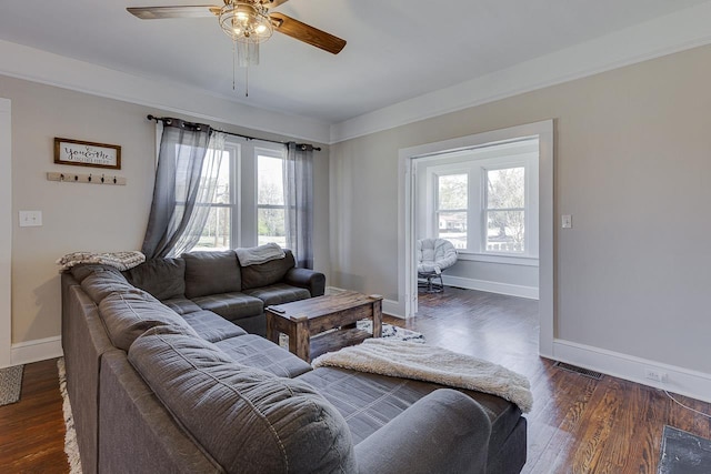 353 E Georgia, Woodruff, SC 29388 - living room featuring baseboards, dark wood-style floors, a healthy amount of sunlight, and ceiling fan