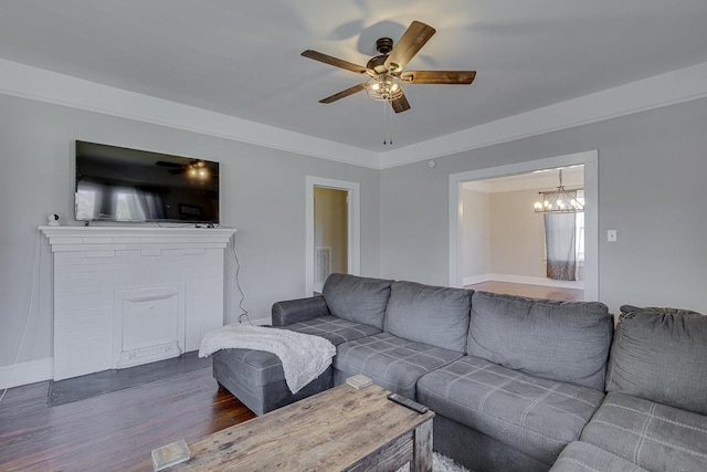 353 E Georgia, Woodruff, SC 29388 - living area with ceiling fan with notable chandelier and wood finished floors