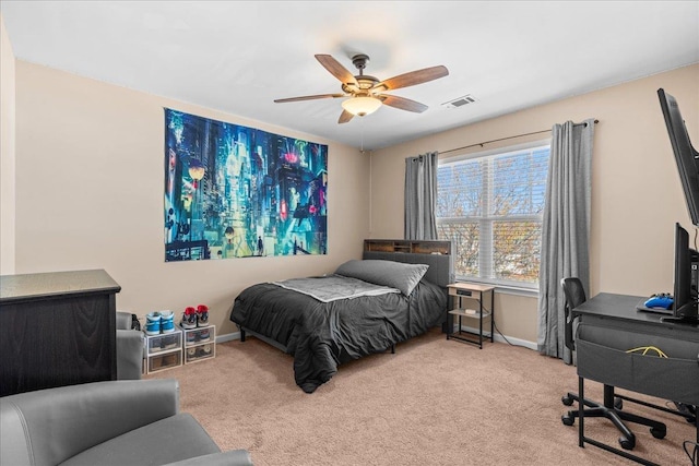 bedroom featuring baseboards, visible vents, and light colored carpet
