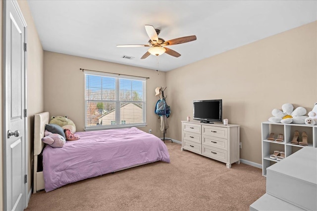 bedroom with light carpet, baseboards, ceiling fan, and visible vents