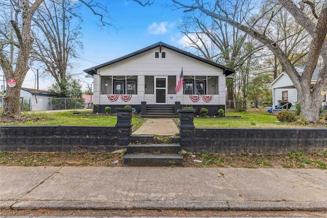 121 Holland, Gaffney, SC 29341 - bungalow-style home featuring covered porch, a fenced front yard, and a front lawn