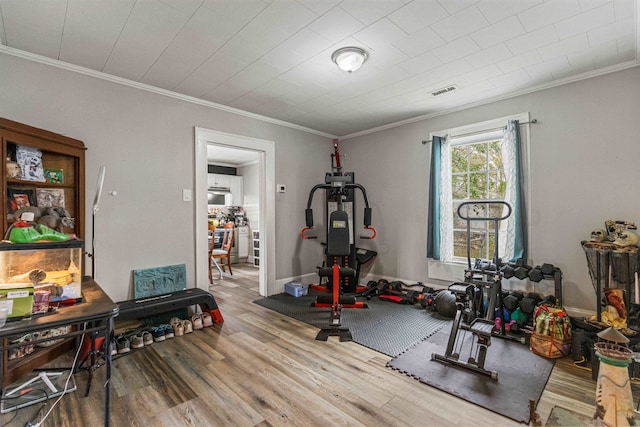 121 Holland, Gaffney, SC 29341 - exercise room with visible vents, wood finished floors, and ornamental molding