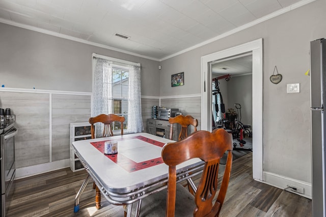 121 Holland, Gaffney, SC 29341 - dining space featuring crown molding, dark wood-style floors, wainscoting, baseboards, and visible vents