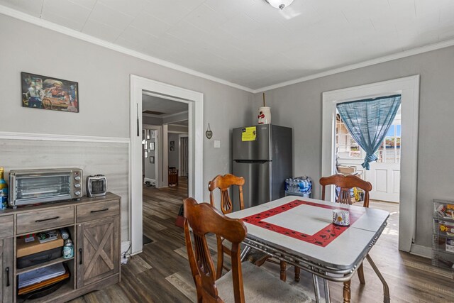 121 Holland, Gaffney, SC 29341 - dining space with dark wood-type flooring, ornamental molding, and a toaster