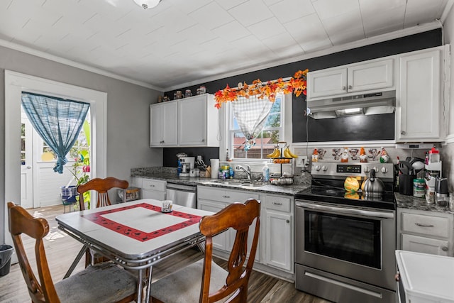 121 Holland, Gaffney, SC 29341 - kitchen with ornamental molding, under cabinet range hood, dark wood-style floors, white cabinets, and appliances with stainless steel finishes