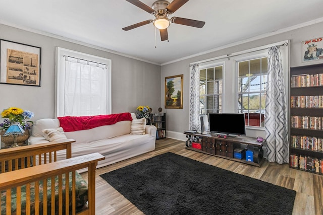 121 Holland, Gaffney, SC 29341 - living area featuring baseboards, wood finished floors, ceiling fan, and ornamental molding