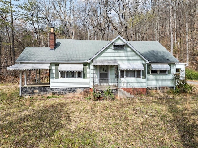 239 Phillips, Greenville, SC 29609 - view of front of property with a chimney and a front yard