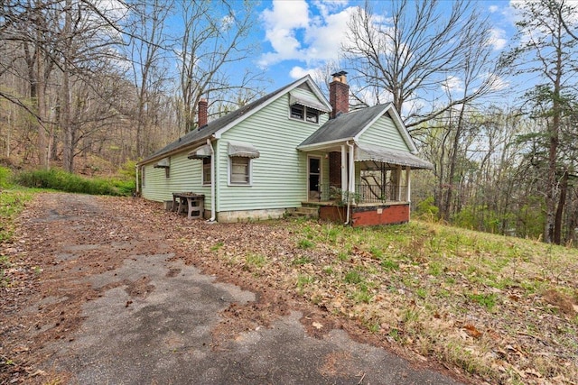 239 Phillips, Greenville, SC 29609 - view of side of property featuring a chimney