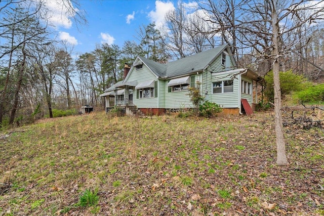 239 Phillips, Greenville, SC 29609 - view of side of property with a chimney