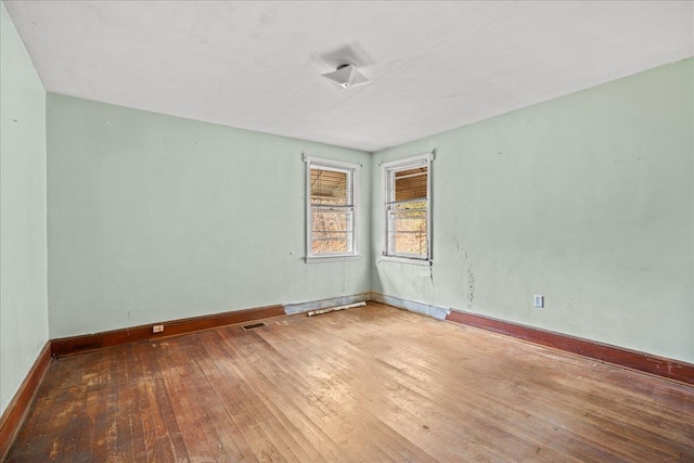 239 Phillips, Greenville, SC 29609 - unfurnished room featuring hardwood / wood-style floors, visible vents, and baseboards