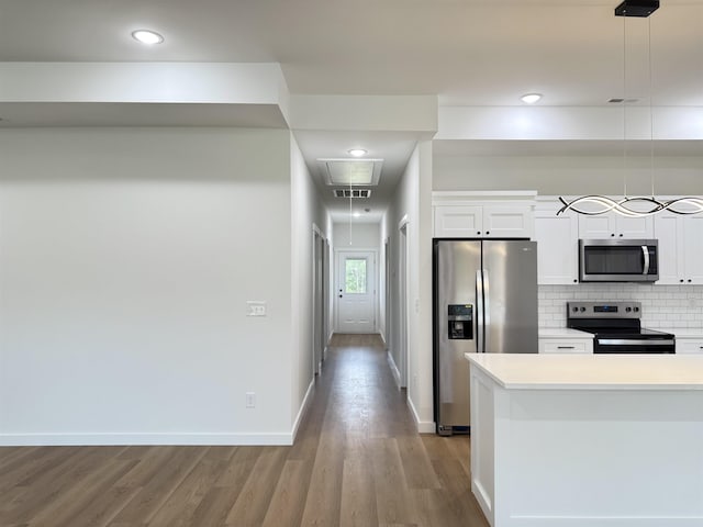 732 Corn Ml, Cowpens, SC 29330 - kitchen with stainless steel appliances, wood finished floors, white cabinets, light countertops, and recessed lighting