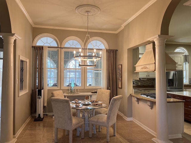 dining area with decorative columns, a healthy amount of sunlight, and crown molding