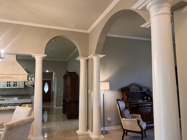 hall featuring arched walkways, ornamental molding, baseboards, and ornate columns