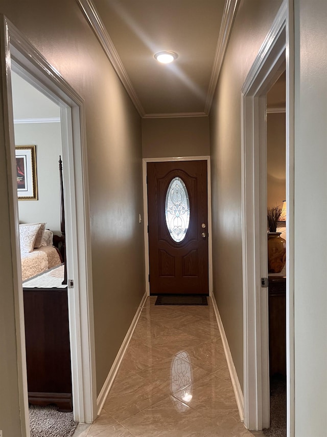 doorway to outside featuring marble finish floor, baseboards, and crown molding