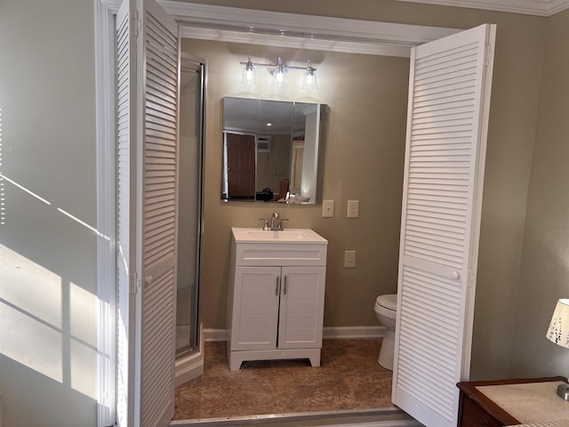 bathroom with vanity, toilet, baseboards, tile patterned floors, and a closet