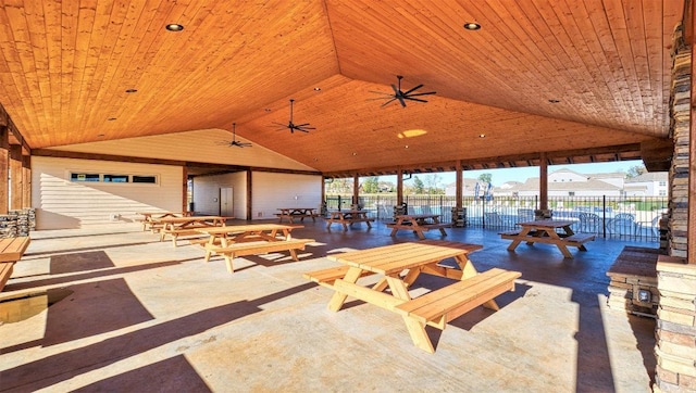 view of patio featuring fence, outdoor dining space, and ceiling fan