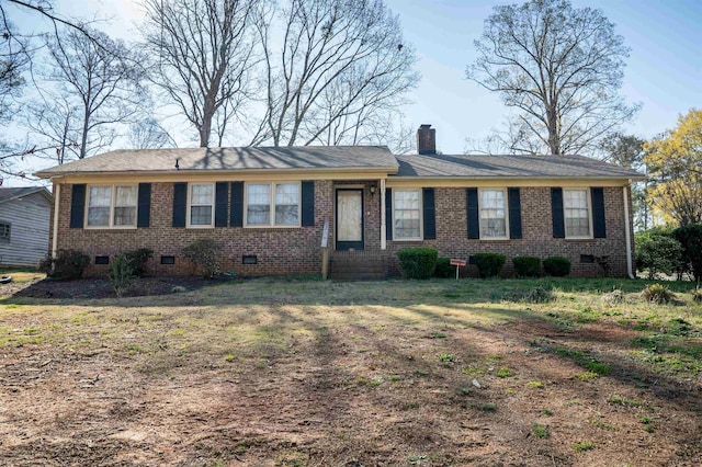 ranch-style house featuring brick siding, crawl space, and a chimney