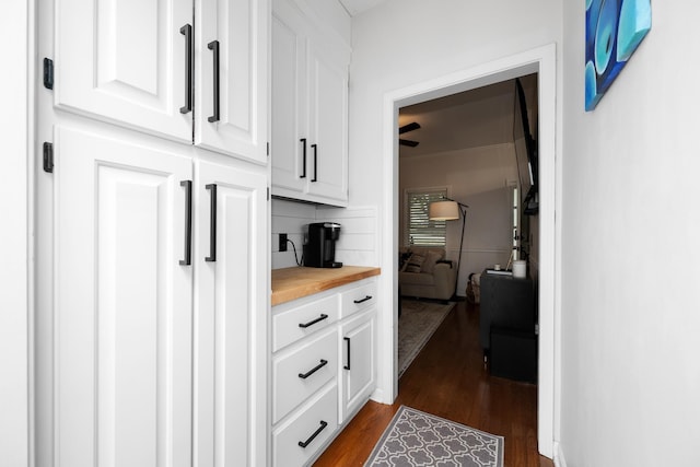 hall with dark wood-style floors