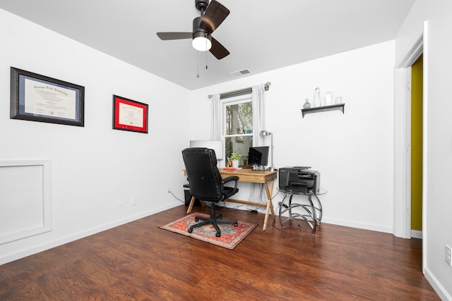 home office featuring baseboards, visible vents, wood finished floors, and ceiling fan