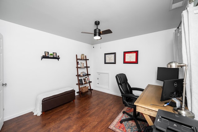 office area featuring baseboards, visible vents, wood finished floors, and a ceiling fan