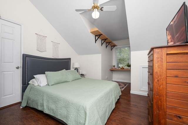 bedroom with baseboards, lofted ceiling, ceiling fan, and wood finished floors