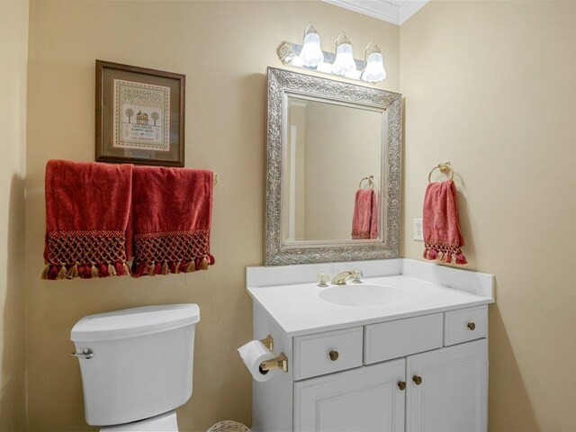 394 Old S, Duncan, SC 29334 - bathroom with vanity, toilet, and ornamental molding