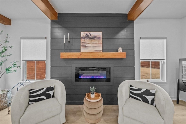 2046 Bluet, Woodruff, SC 29388 - living area featuring beam ceiling, wood finished floors, and a glass covered fireplace