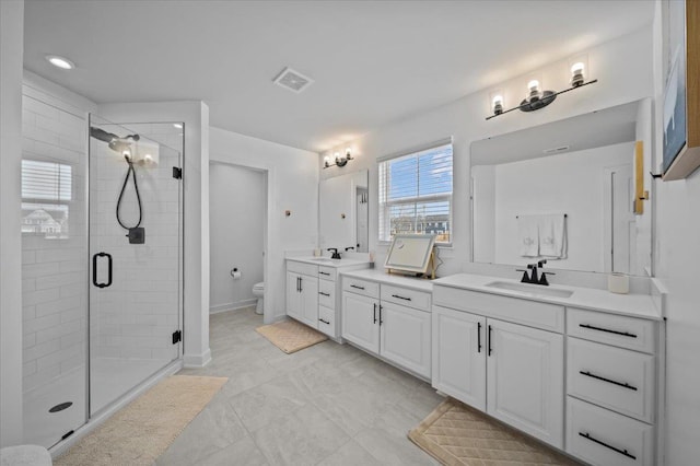 2046 Bluet, Woodruff, SC 29388 - full bath featuring a shower stall, visible vents, toilet, a sink, and double vanity