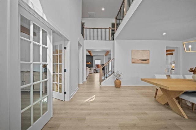2046 Bluet, Woodruff, SC 29388 - foyer with baseboards, a high ceiling, stairs, visible vents, and wood finished floors