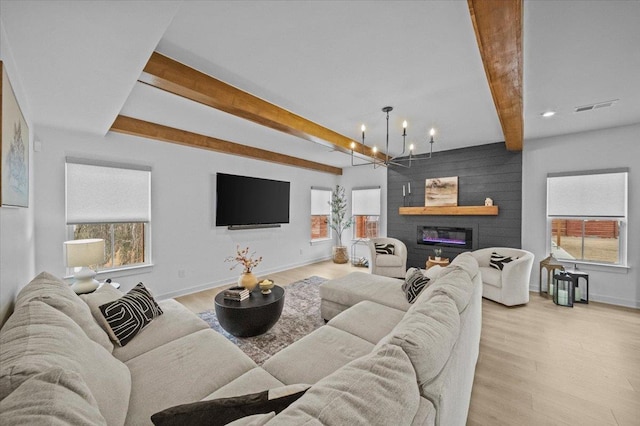 2046 Bluet, Woodruff, SC 29388 - living room featuring visible vents, baseboards, a chandelier, light wood-style floors, and beam ceiling