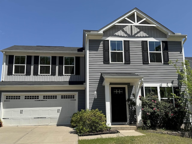 view of front of house with a garage, board and batten siding, and concrete driveway