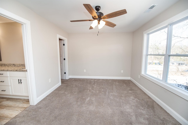 100 Winterhaven, Spartanburg, SC 29301 - unfurnished room with visible vents, baseboards, a ceiling fan, and light carpet