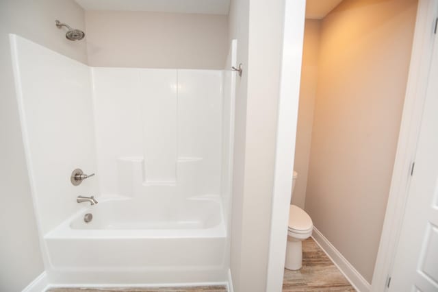 100 Winterhaven, Spartanburg, SC 29301 - bathroom with toilet, wood finished floors, baseboards, and shower / bathtub combination